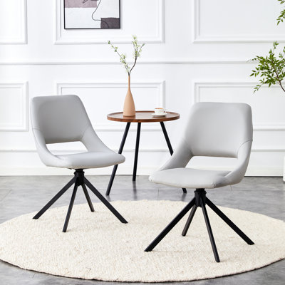 Ensemble de 2 chaises de salle à manger modernes grises avec assise en similicuir doré, dossier haut, assise confortable, pivotantes à 360°, retour automatique à 180°, montage facile et surface imperméable et antidérapante.