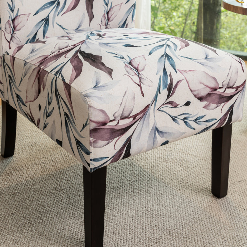 Fauteuil en tissu imprimé avec motif floral mauve - Espace de vie moderne, assise confortable et sans accoudoirs