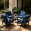 Ensemble de conversation d'extérieur en teck pour quatre personnes avec coussin et deux tables d'appoint-738850632-738850633