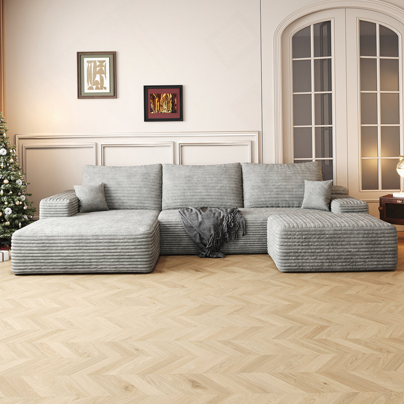 Canapé modulaire confortable en forme de U avec repose-pieds, idéal pour les salons