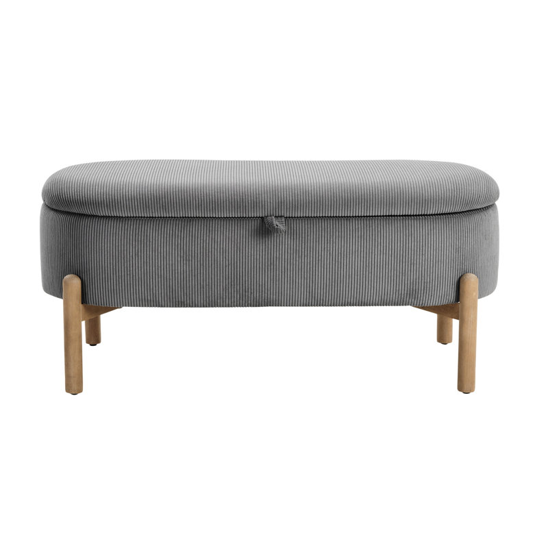 Banc de rangement élégant en velours côtelé gris avec des pieds en bois massif et une base polyvalente d'inspiration Mid-Century