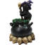 Figurine de sorcière chapeau noir de sorcière dans un chaudron à DEL avec crânes