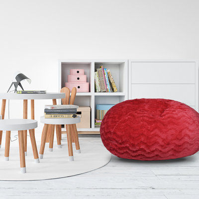 Pouf poire en fausse fourrure rouge, 90 cm. Luxe et confort combinés pour les adultes. Garnissage en mousse à mémoire de forme déchiquetée. Housse hygiénique amovible. Parfait pour un coin détente dans la chambre. Diamètre : 86 cm, hauteur : 69 cm.