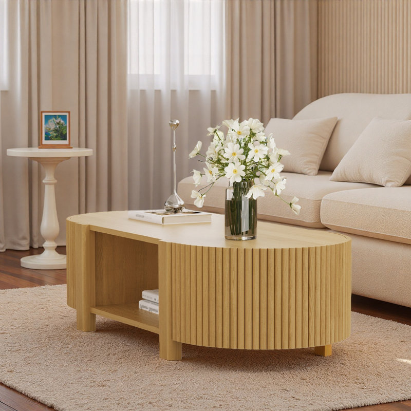 Table basse ovale cannelée avec 1 tablette et 2 portes de rangement ouvertes