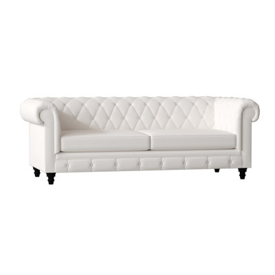 Canapé Chesterfield à accoudoirs roulés