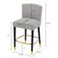 Le tabouret de 27 pouces au design moderne avec un tissu lisse et léger et un repose-pieds circulaire avec une finition dorée, crée un look sophistiqué et luxueux-41881666