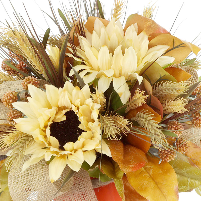 Arrangement d'automne tournesol, chardon et blé dans un vase en verre