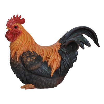 Figurine de coq accroupie
