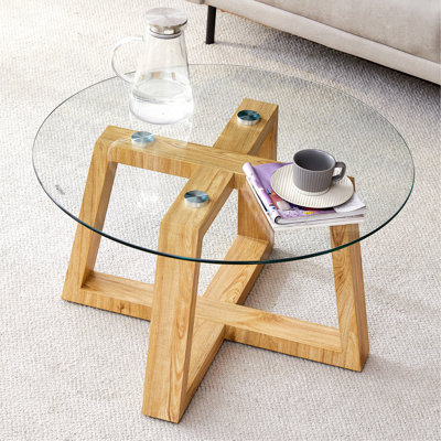 Tables basses modernes et pratiques. Fabriqué en plateau de table en verre trempé transparent et en bois aggloméré de couleur bois.