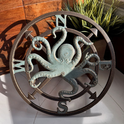 Nautical cast iron octopus compass rose hose holder in bronze verde patina, 11.75 inches high