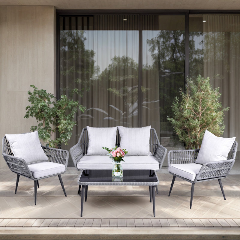 Gonneke Premium All-Weather Wicker 4 - Person Patio Conversation Set with Cushions