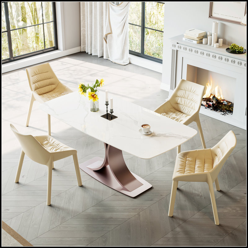Table de salle à manger élégante en cuivre rouge et acier au carbone avec plateau en pierre Snow Mountain brillant, capacité de charge élevée pour les maisons modernes