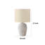 Lampe de table Ezzy avec base en rotin blanc, abat-jour en lin ivoire-117053992