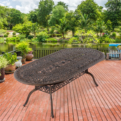 Mahyar Oval Metal Outdoor Dining Table With Umbrella Hole , 87'' in. W 42'' in. D