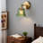 Vintage Green Carved Glass Wall Sconce With Brass Finish – Warm Ambient Bedside Lamp
