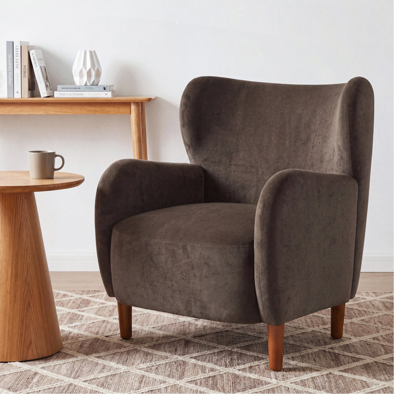 Fauteuil club à oreilles rembourré