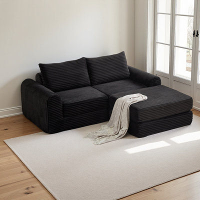 Minimalist corduroy sofa featuring curved lines and a gently sloped backrest, 2-in-1 Sofa & Bed,complete with two throw pillows