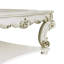 Table basse Vendome avec pieds à volutes et garniture décorative, parfaite pour les espaces de vie élégants