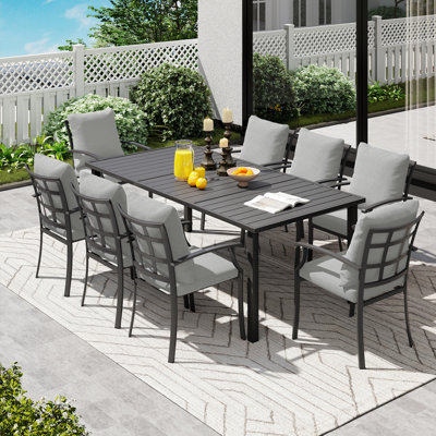 Ensemble repas de patio en métal noir 9 pièces avec table rectangulaire et coussins gris Maynard