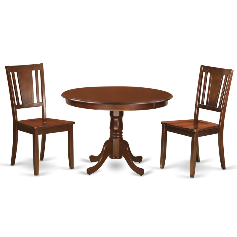 L'ensemble de salle à manger 3 pièces comprend une table de salle à manger ronde avec piédestal et 2 chaises de cuisine, acajou