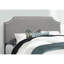 Lit double tapissier de style lin gris avec garniture pour tête de lit et classe décoratives