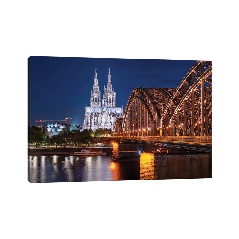 Aerial View Of The Cologne Cathedral And Hohenzollern Bridge At Night by Jan Becke - Wrapped Canvas Print