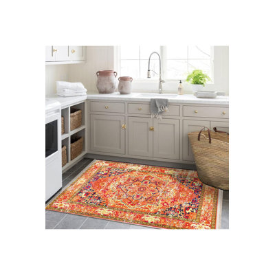Tapis traditionnel lavable à la machine à motif floral orange