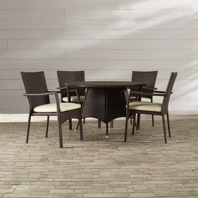 Arturas 4 - Person Wicker Patio Dining Set with Round Table , Cushions Included, Brown