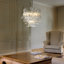 Luminaire suspendu de style moderne Mid-Century à 4 lumières en verre transparent à 4 niveaux avec finition bronze antique Kass pour salon, salle à manger Kass-992069871-1005842399-992069865