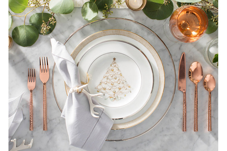 Christmas table with Christmas tree plates and cutlery