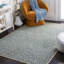 Banerjee Animal Print Cream/Spruce Area Rug-478914437