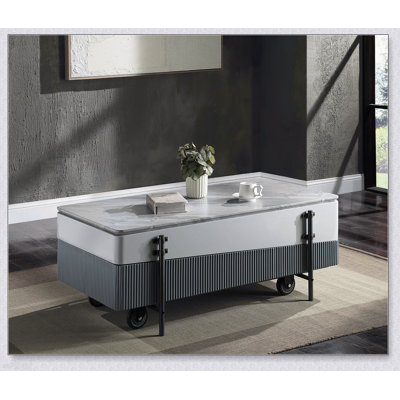 Table basse grise et blanche avec plateau relevable, parfaite pour la vie moderne et les solutions de rangement