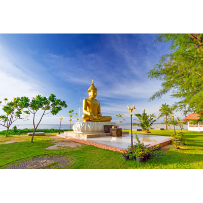 Statue Of Golden Buddha At The Sea by Patryk Kosmider - Wrapped Canvas Print