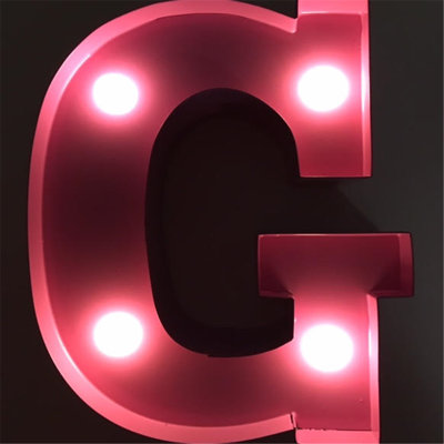 Enseigne lumineuse del lettre g