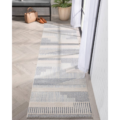 Tapis à motif géométrique abstrait bleu clair Marcone Briar