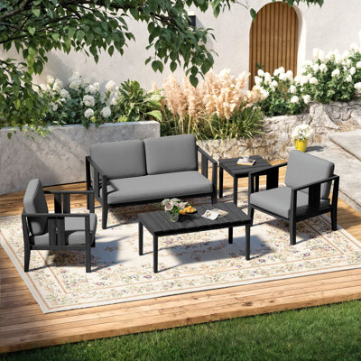 Ensemble de patio d'extérieur pour quatre personnes en teck avec coussins et deux tables Junco