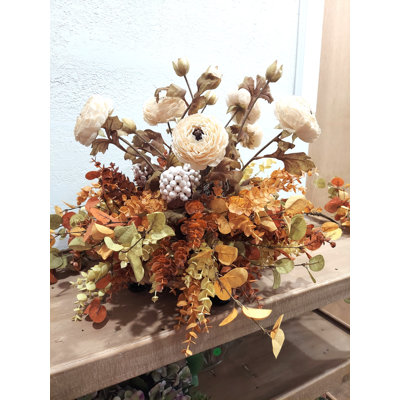 Ranunculus, Berry Pod, And Eucalyptus Centerpiece