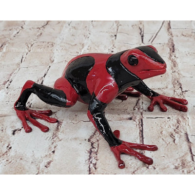 Figurine de grenouille rouge et noire