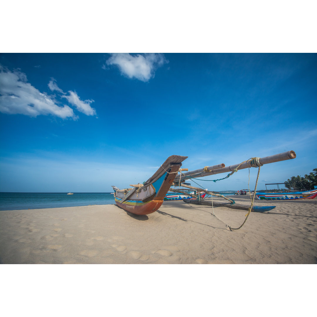 Burnes Colourful Boat At Trincomalee Beach In Sri Lanka by Erandalx - Wrapped Canvas Print