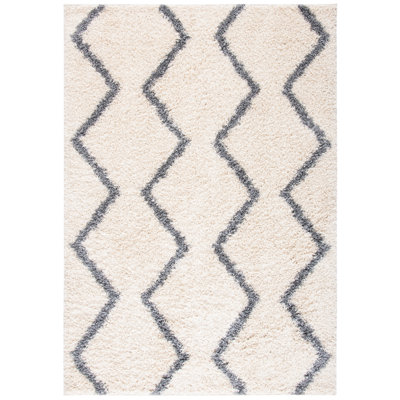 Tapis ivoire à motif géométrique