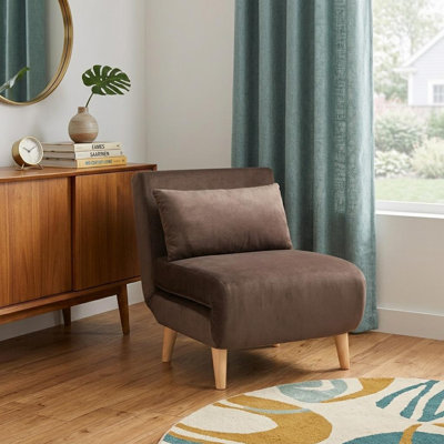  Fauteuil convertible brun avec coussin décoratif