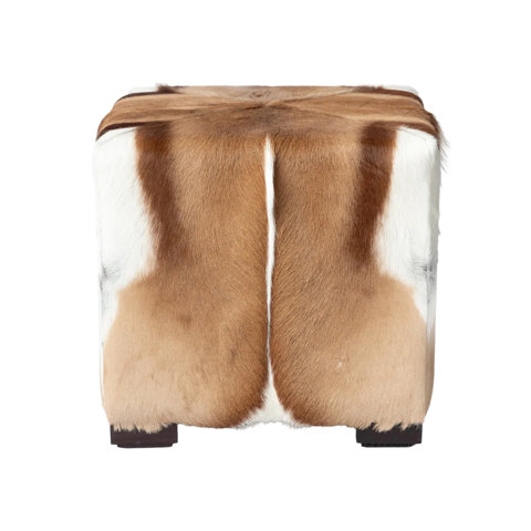 Square ottoman upholstered in genuine tri-color brown and white cowhide.