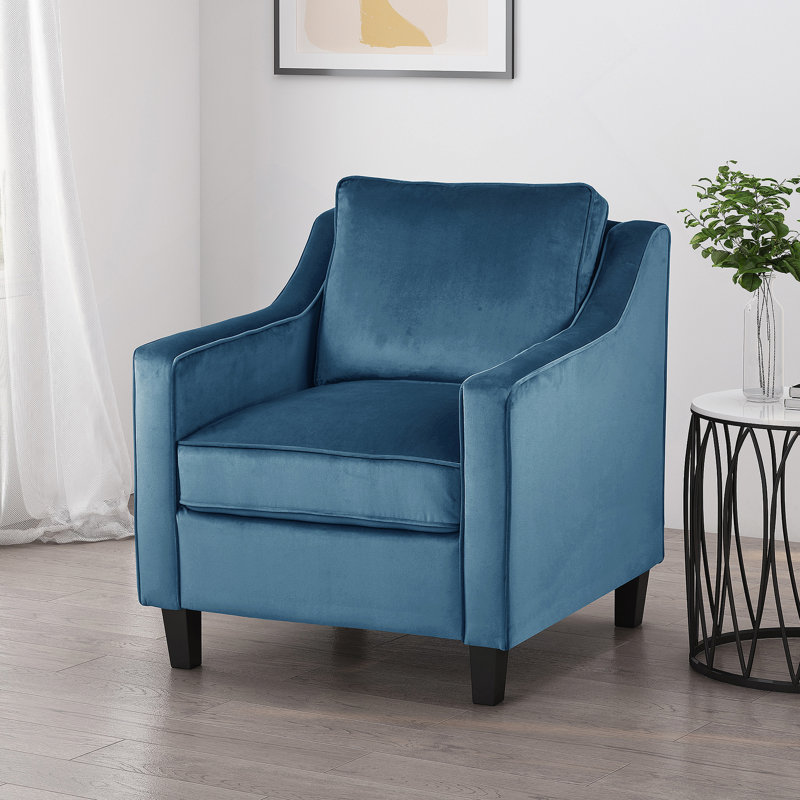 Fauteuil club en velours bleu
