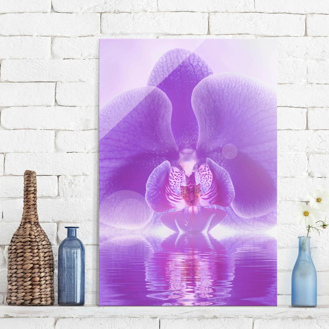 Glasbild Orchidee auf Wasser in Lila