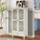 Grande armoire de rangement rustique avec tiroir et portes en bois sculpté, avec des pieds en bois massif pour une organisation polyvalente.
