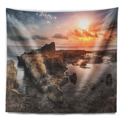 Tapisserie coast coucher de soleil au-dessus de rocky africain