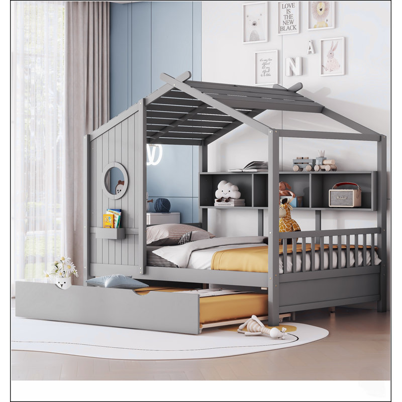 Lit cabane en bois pour enfants avec lit gigogne et étagères de rangement, idéal pour les chambres d'enfants et les jeux créatifs.