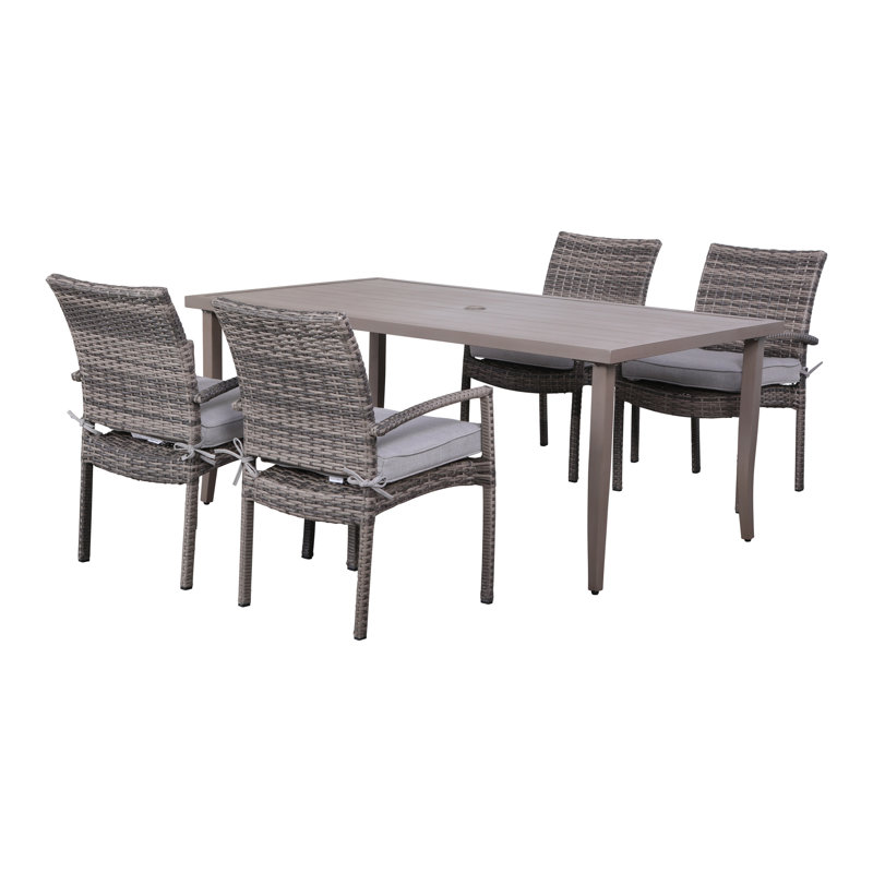 Alieyah 4 - Person Wicker Patio Dining Set with Rectangular Table , Cushions Included