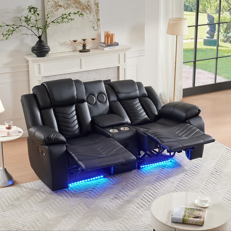 Ensemble de canapés inclinables manuels en similicuir noir à surpiqûres ondulées (2 pièces) : canapé 3 places et causeuse 2 places avec console centrale, haut-parleurs Bluetooth, porte-gobelets et éclairage d'ambiance DEL bleu. Mobilier home cinéma.