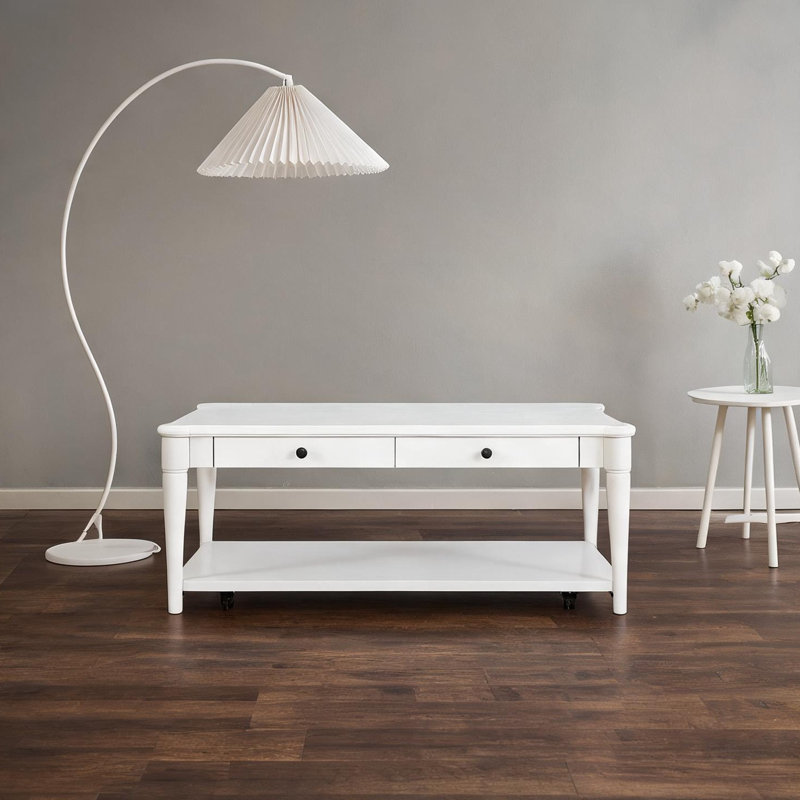 Table basse transitionnelle avec deux tiroirs de rangement et roulettes en bois massif blanc